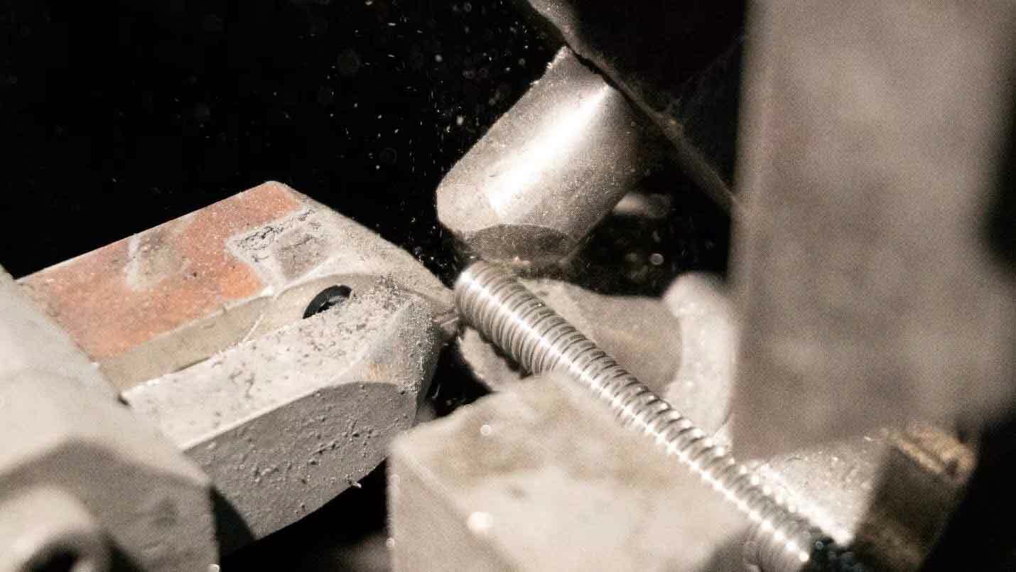 Close up of a screw being made